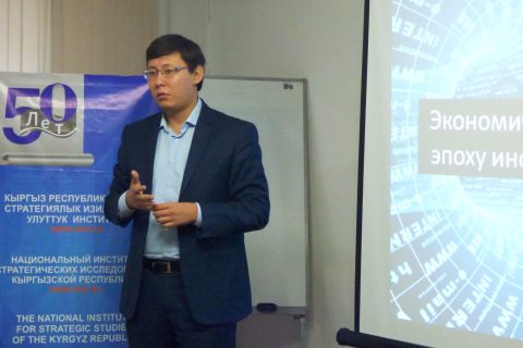 Man giving a presentation on digital strategy in Kyrgyzstan.