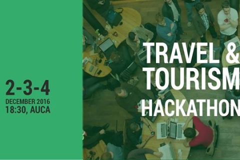 A group of people working together at a hackathon event focused on travel and tourism.