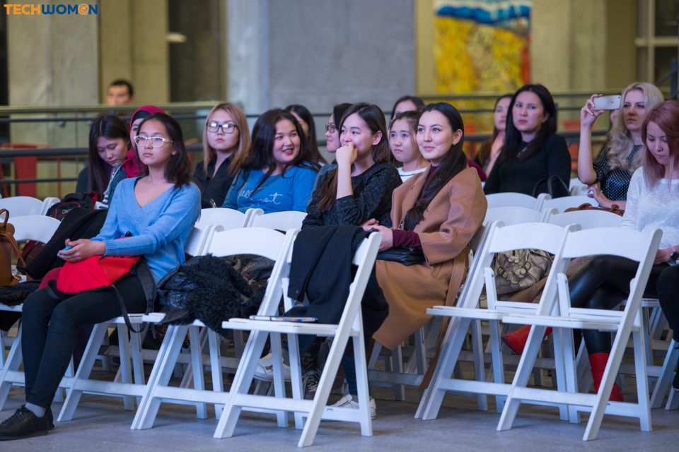 Attendees at a tech event in Bishkek, Kyrgyzstan, listening intently.