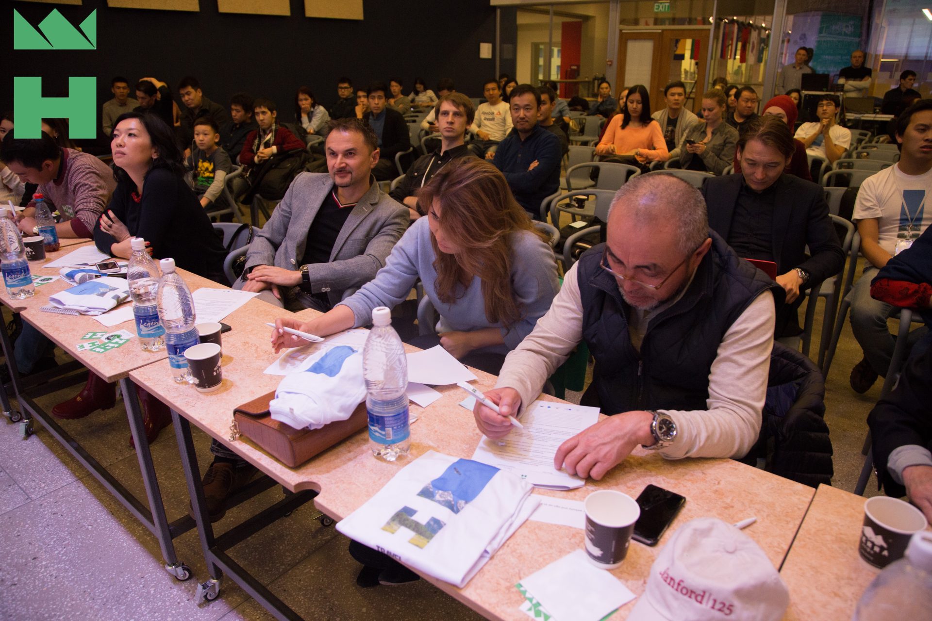 Participants at a workshop in Bishkek, Kyrgyzstan, engaged in discussions and activities.