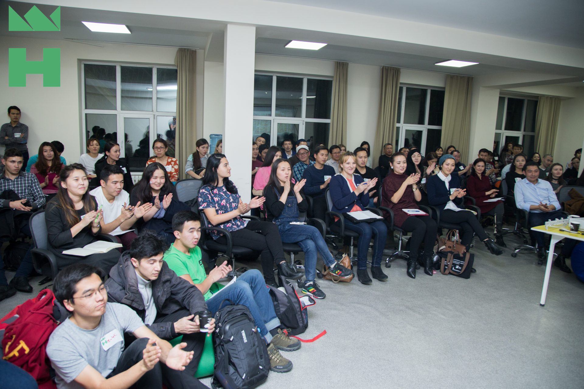 Participants clapping in an event organized by KG Labs Foundation in Bishkek, Kyrgyzstan.