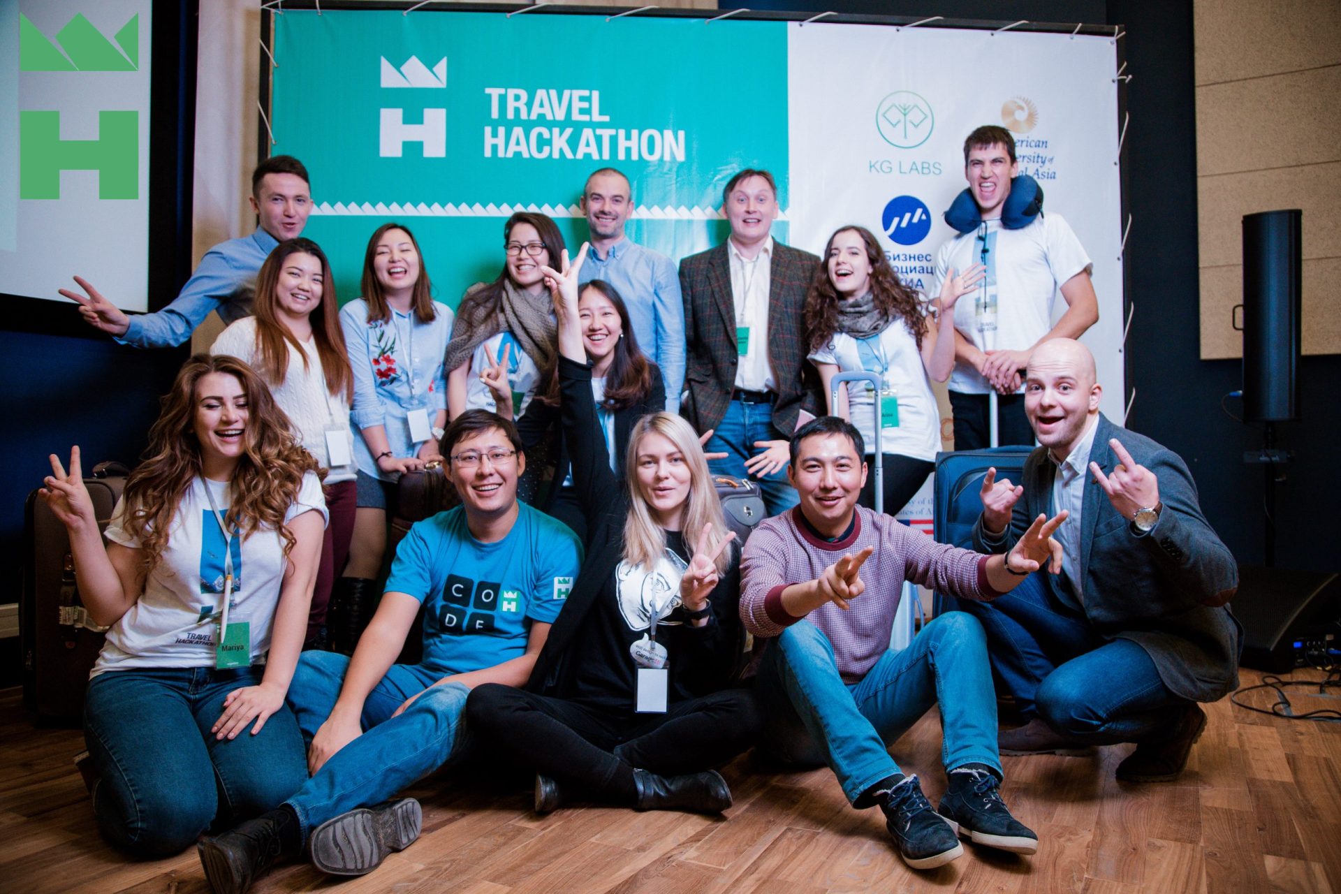 Participants at a Travel Hackathon event in Bishkek, Kyrgyzstan, posing for a group photo.