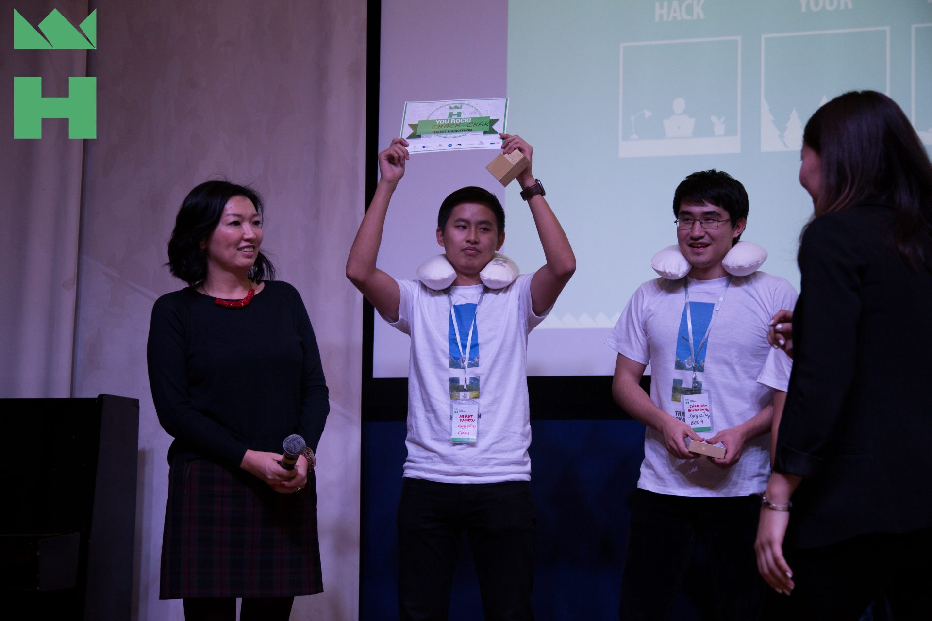 Participants holding up an award at a KG Labs Foundation event in Bishkek, Kyrgyzstan.