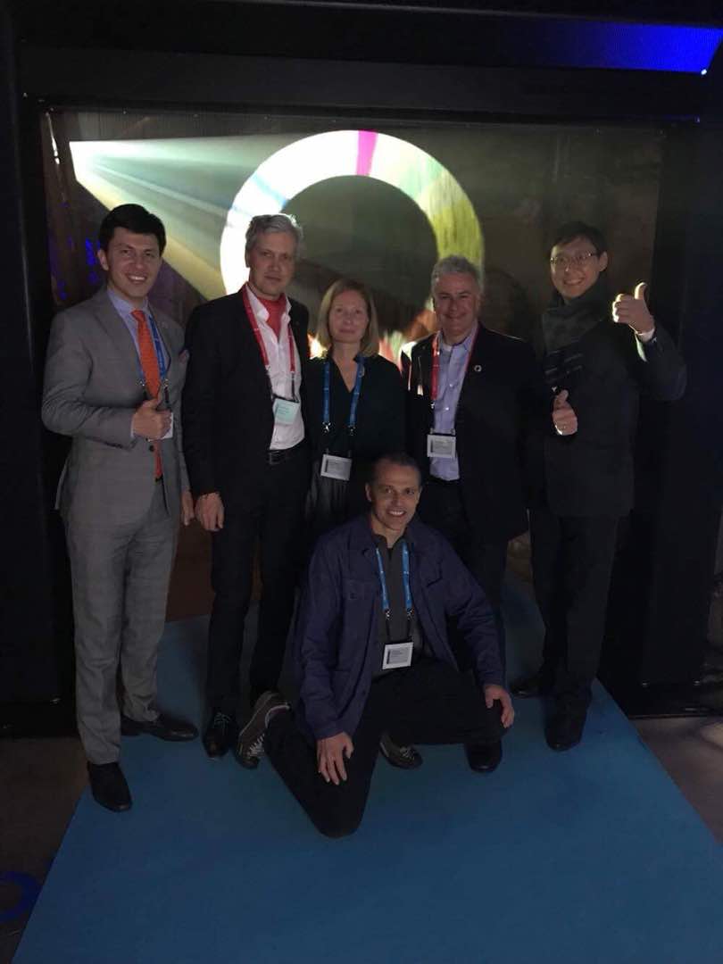 A group of people posing for a photo at an event.