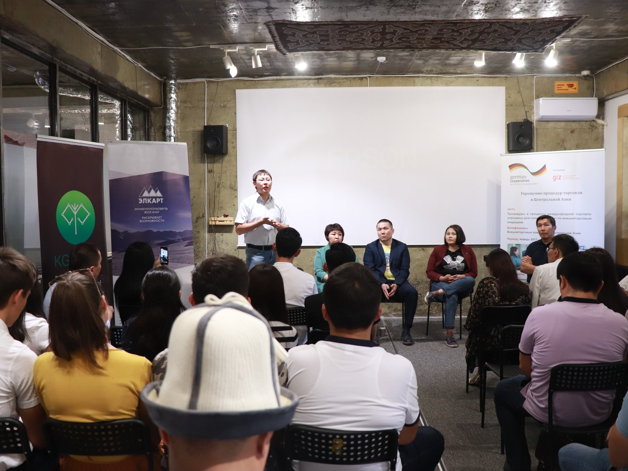 Participants and speakers at a logistics-focused IT startup event in Bishkek, Kyrgyzstan.