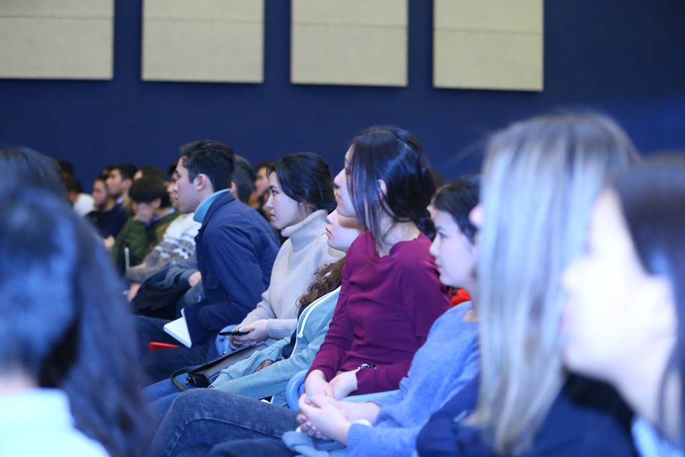 Participants in the Creative Spark program listen attentively during a meeting in Bishkek, Kyrgyzstan.