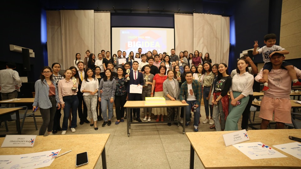 A group of people posing for a photo at an award ceremony for the British Council's Creative Spark project.