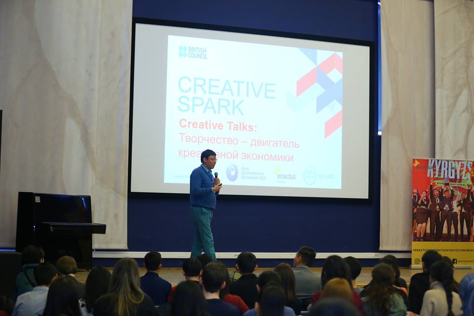 Speaker presenting at a Creative Spark event in Bishkek, Kyrgyzstan.