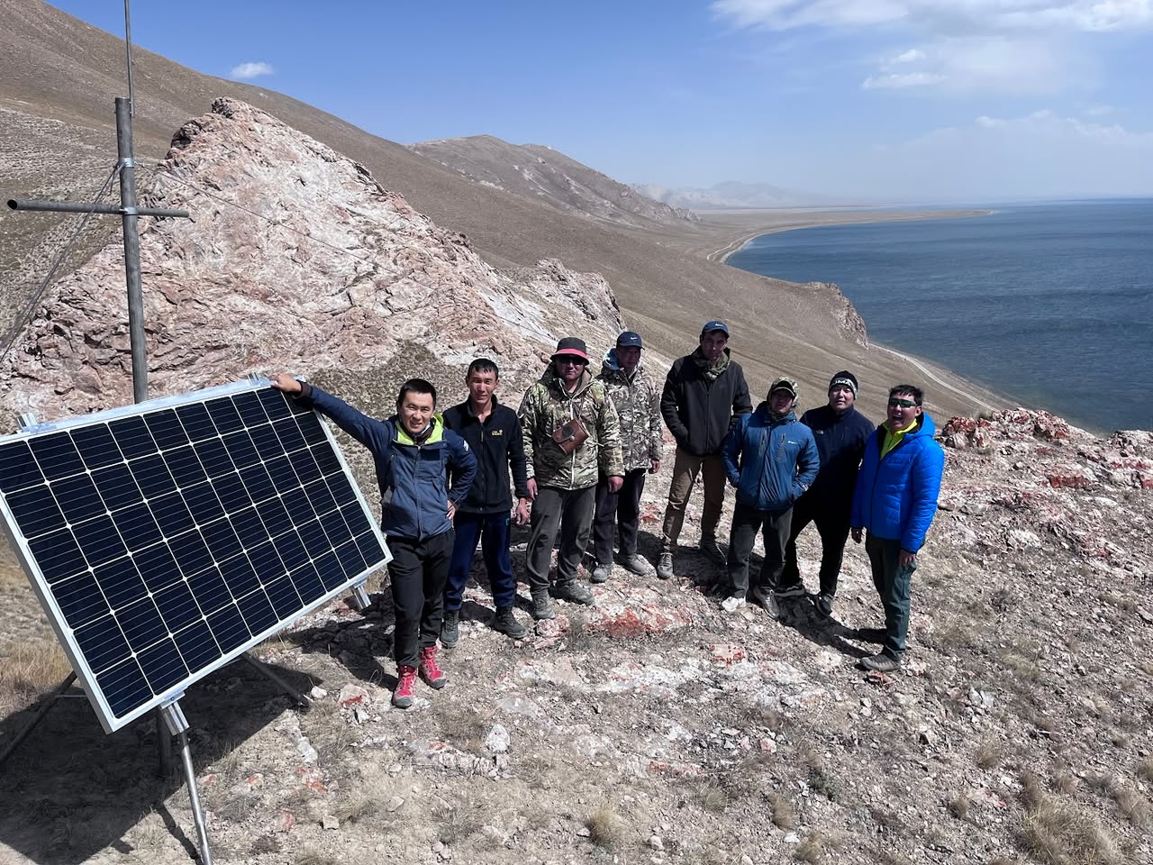 On the water at Chatyr-Kul during the install. The sensor will spend the winter under metres of ice; the gateway and uplink stay on dry ground.