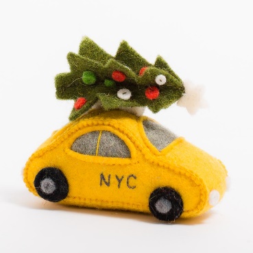 A Craftspring contemporary-design felt ornament — a New York City taxi with a Christmas tree — hand-embroidered in Kyrgyzstan, sold from a Brooklyn storefront. The product range carries roughly 500 SKUs in this style. Source: Craftspring product catalogue, via ITC Ready4Trade research, 2021.